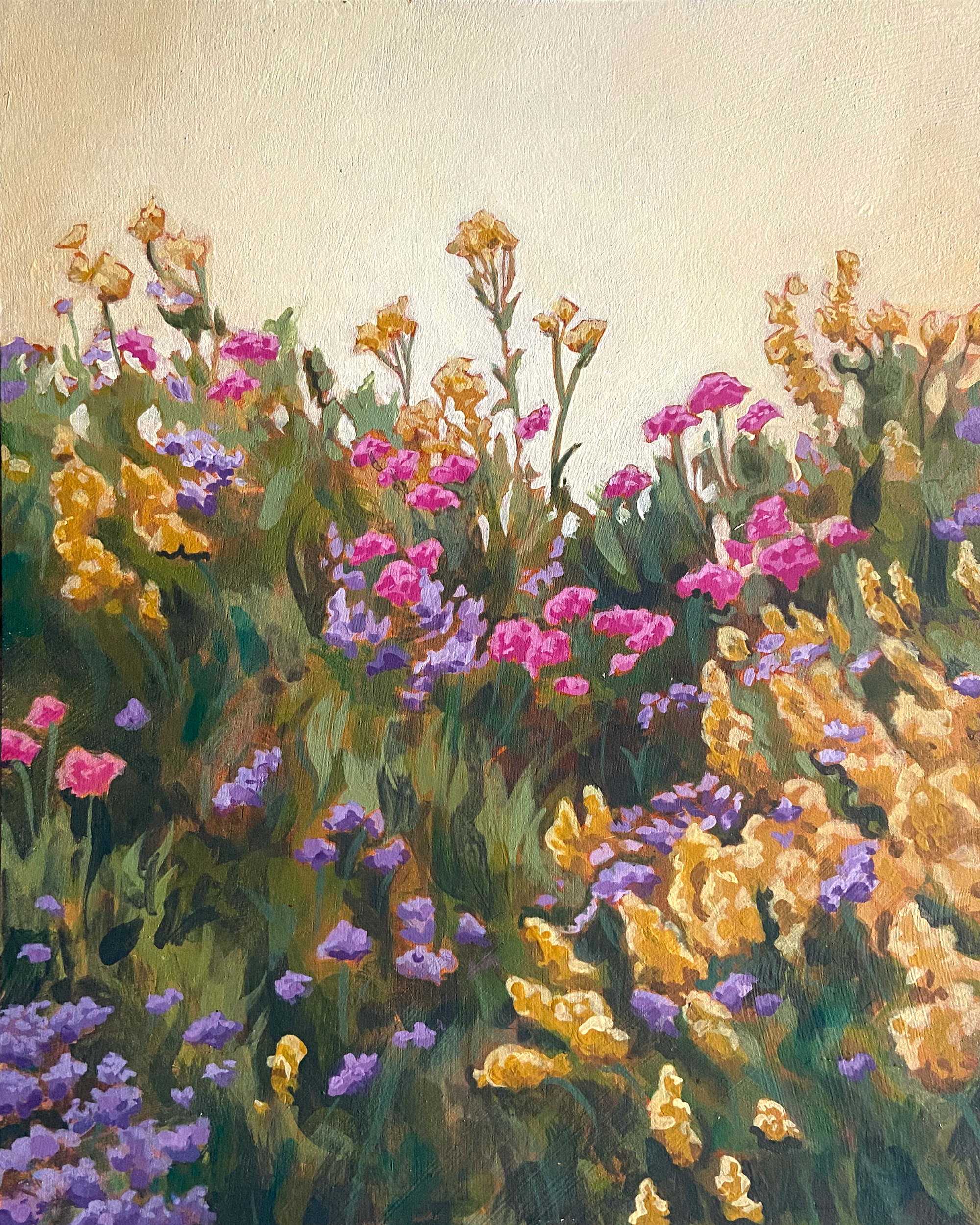 A painting of gold, pink and purple flowers in a lush green field in front of a bright golden sky.
