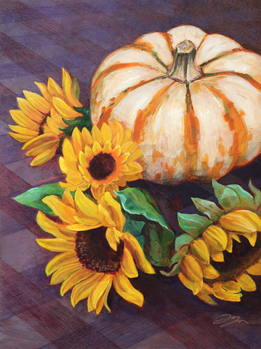 A painting of an orange and white striped pumpkin with four yellow sunflowers around its base. They all rest on a deep purple checkered tablecloth.