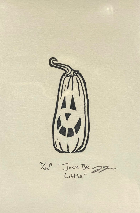 A small black-and-white print depicting a tall pumpkin with a carved jack-o-lantern face. The print is made by hand using a carved eraser and is numbered, titled and signed.