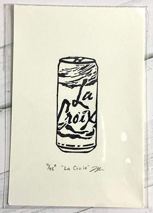 A black and white relief print of a can of La Croix seltzer. The prints are made by hand from a carved eraser and are numbered, titled and signed.