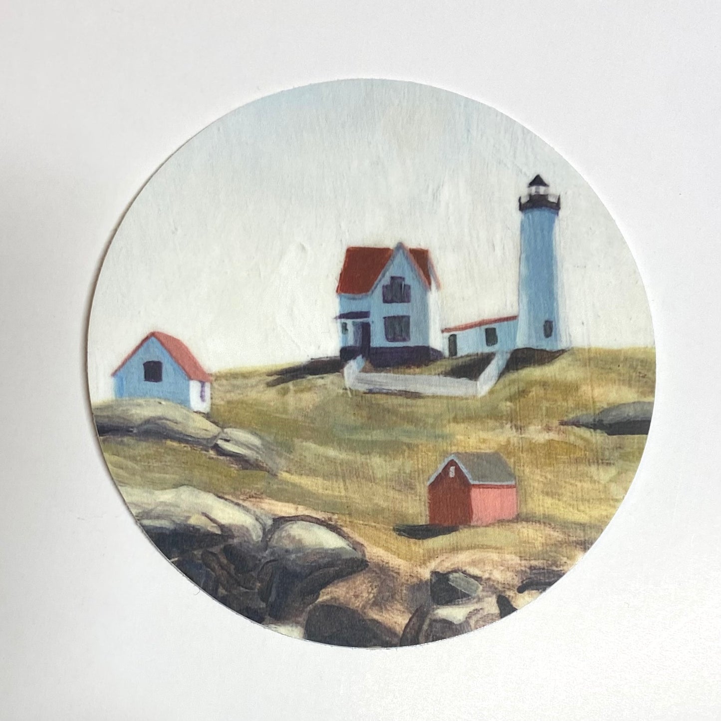 A sticker of Jackie Hanson's Nubble Lighthouse painting. Nubble Light is located in York, Maine.