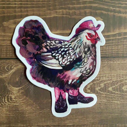 A die-cut vinyl sticker of a painted black-and-white chicken in pink cowgirl boots and hat.