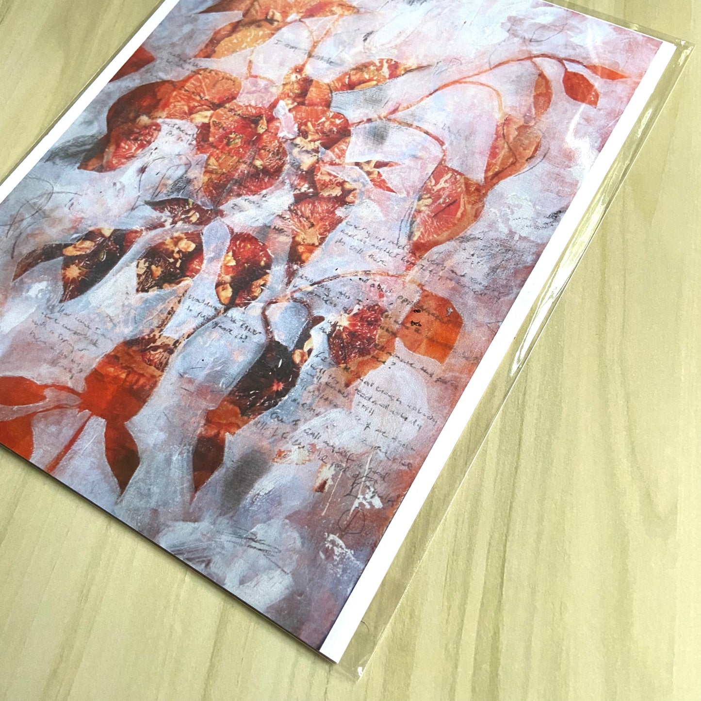 A detail look at the art print shows the textured paint marks used to create the plant shape. The artist's signature is in the bottom right. Pencil smudges and writing creates variation from white to gray in the negative space of the painting.