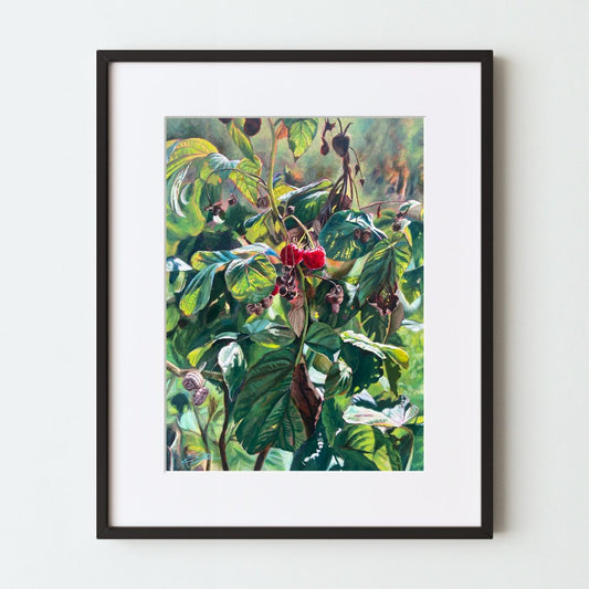 A mockup of a botanical art print in a black frame with a white mat. The realistic painting depicts a late-season raspberry plant with two ripe berries at center. This acrylic artwork is notable for its strong use of light.