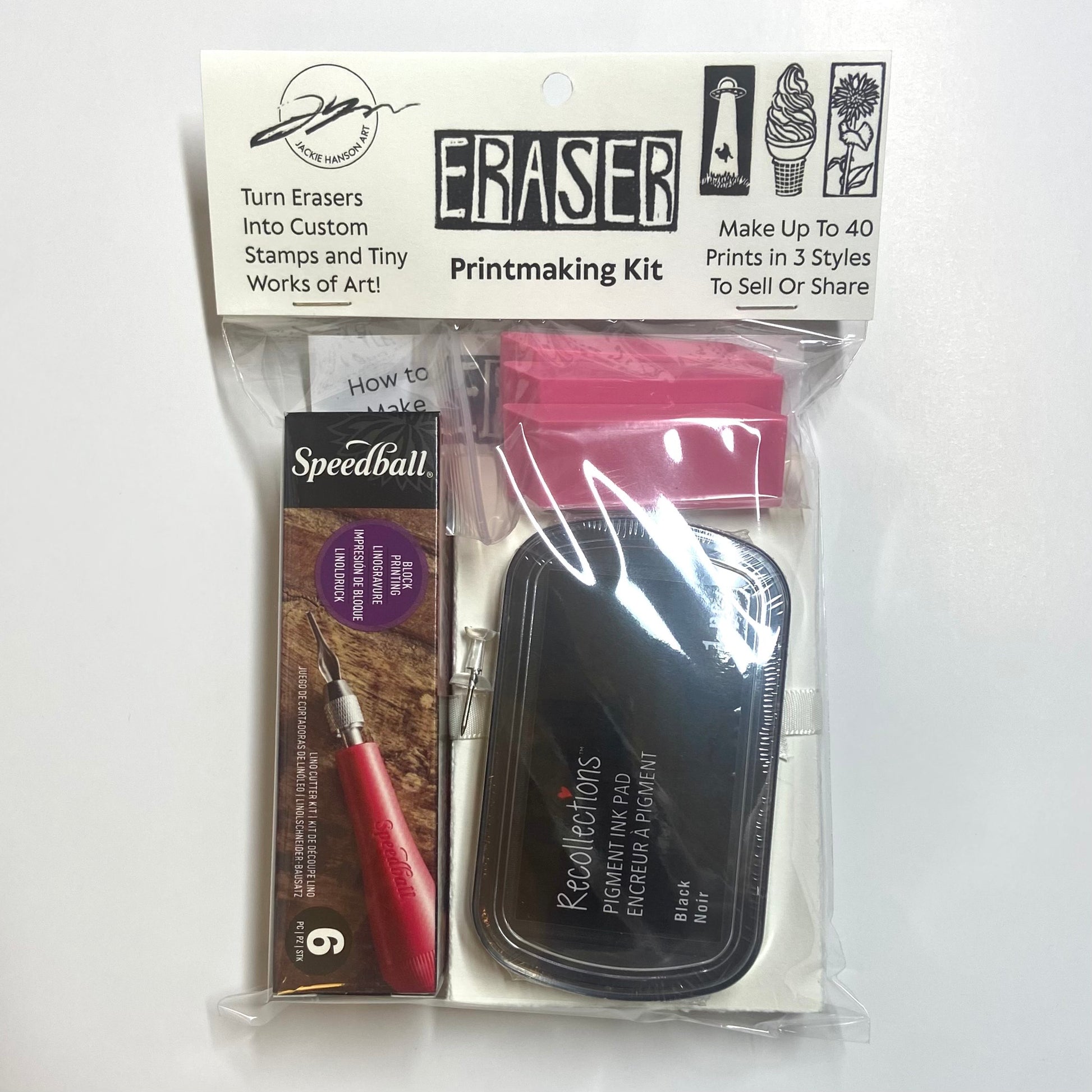 An eraser printmaking kit on a white background, which includes a linocut carving tool, black ink pad, three erasers, and more on a white background.
