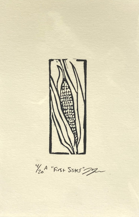 A rectangular black-and-white print of an ear of corn, enclosed at the edges by a thin line border.  The print is made by hand using a carved eraser and is numbered, titled and signed. 