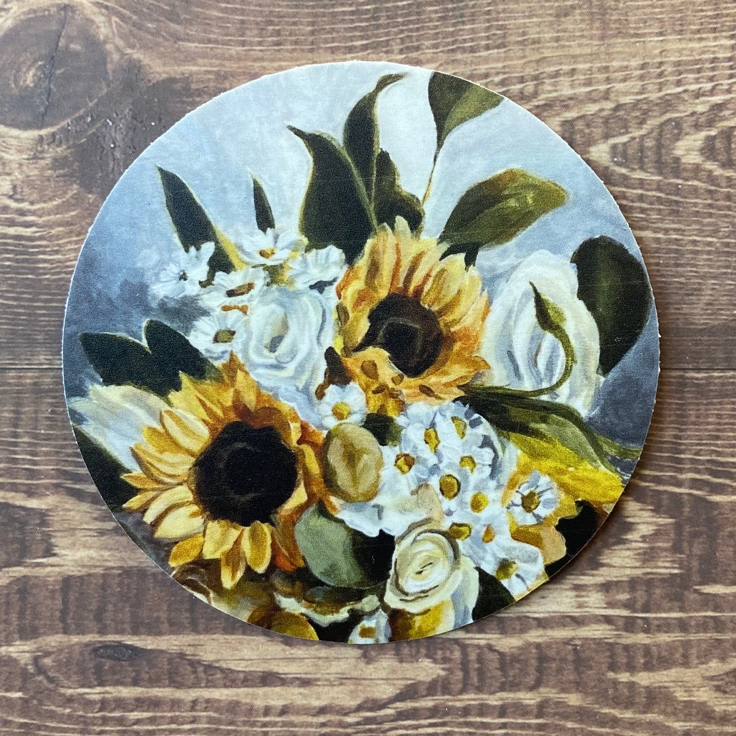 A round sticker of my painting "Green Gold", depicting a bouquet of sunflowers, daisies, white roses and greenery.