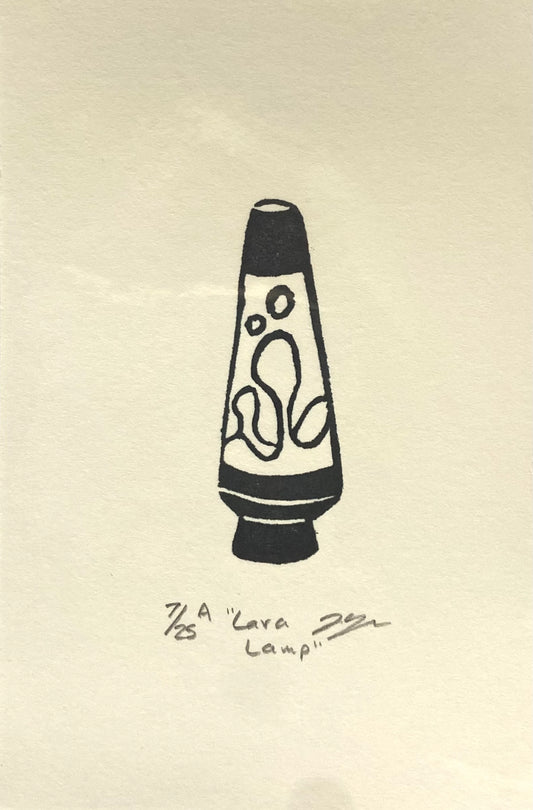 "Lava Lamp" an eraser block print by New Hampshire artist Jackie Hanson. A small, hand-stamped image of a lava lamp, in black ink on white paper. This was made by carving a pink eraser.