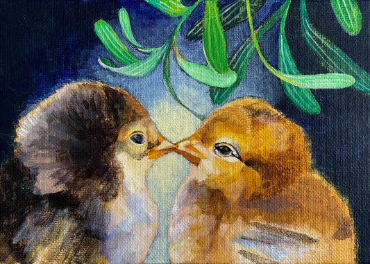A painting on canvas panel of two baby chicks kissing under the mistletoe. The chick on the left is brown or black, and the one on the right is yellow. The background has radiant light and blue shadows.