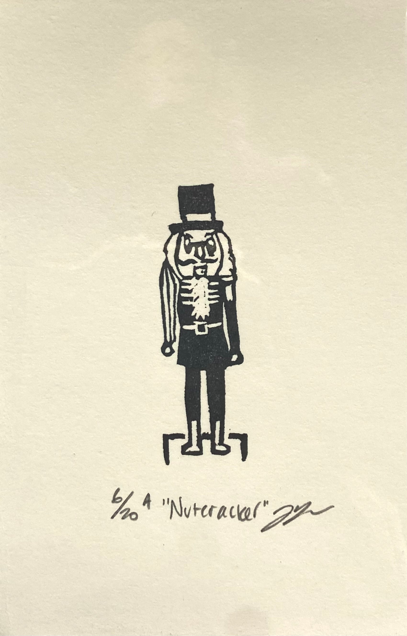 A small black-and-white print of a traditional Christmas nutcracker.  The print is made by hand using a carved eraser and is numbered, titled and signed. 