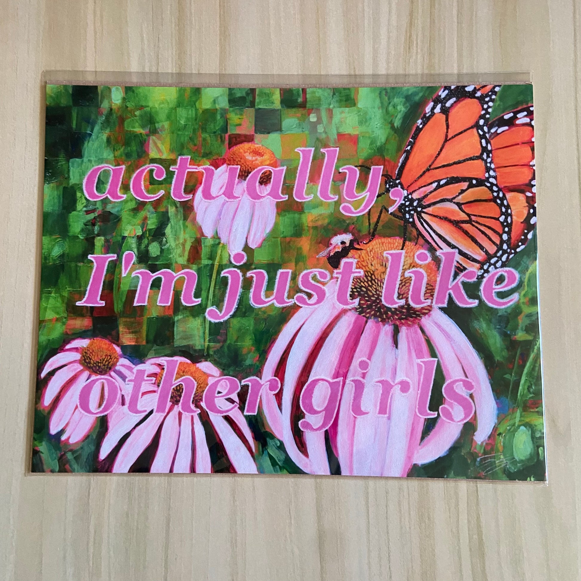 An art print with an orange butterfly, bumblebee, and pink cone flowers over a partially checkered green backdrop. Overlaid on the painting is the phrase "actually, I'm just like other girls", written in hot pink lined with white glitter.