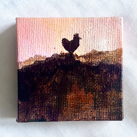 A small square painting of a chicken in silhouette, on top of a dark hill in front of a light pink sky. 