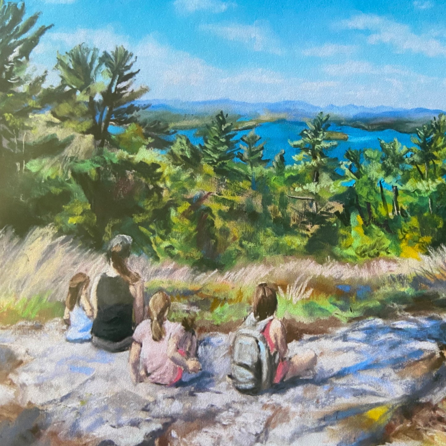 A close-up view of the landscape art print. In view is the family on the hillside, some of the pine trees in midground and parts of the lake and mountains in the distance. You can see the texture and vibrant colors of the soft pastel painting.