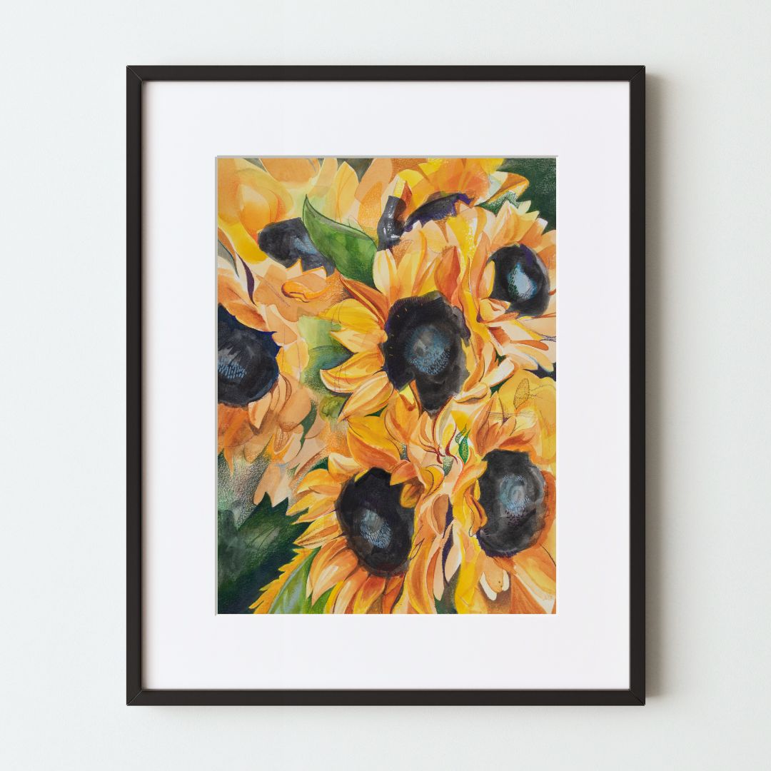 A mockup of a framed art print depicting several watercolor sunflowers. 