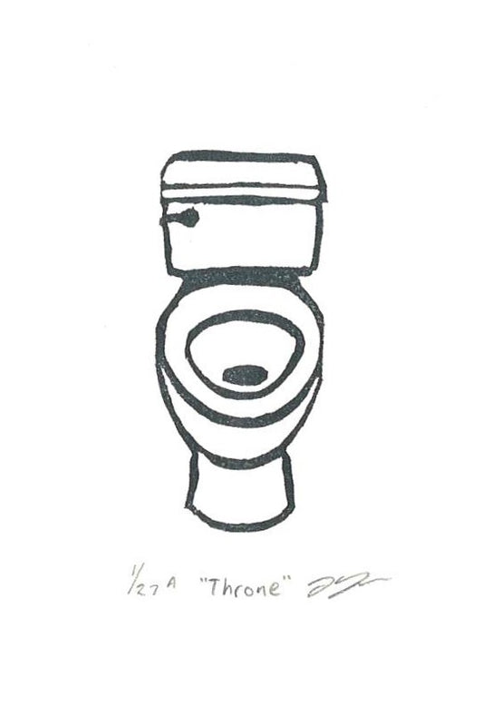 A small block print of a toilet.