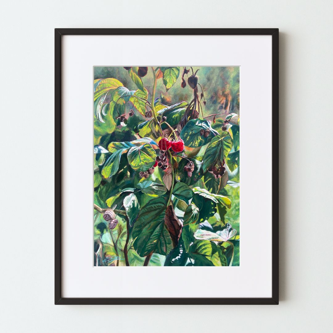 A mockup of a botanical art print in a black frame with a white mat. The realistic painting depicts a late-season raspberry plant with two ripe berries at center. This acrylic artwork is notable for its strong use of light. 